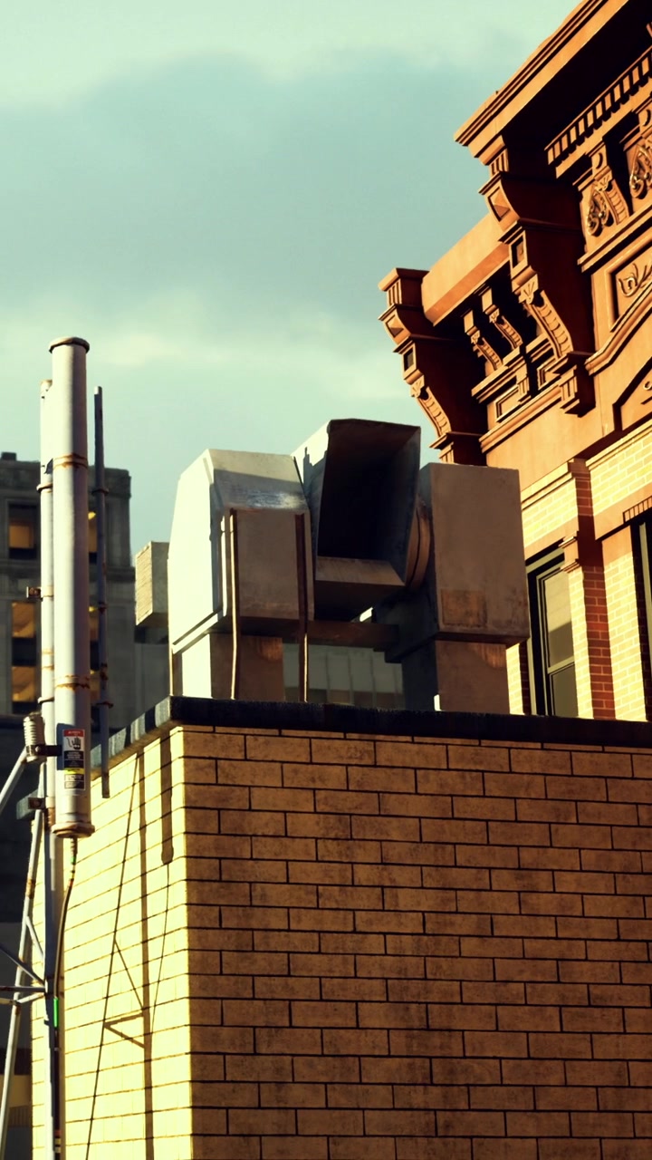 Metal ventilation system on building roof in urban setting during daylight