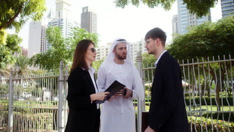 three people talking about business