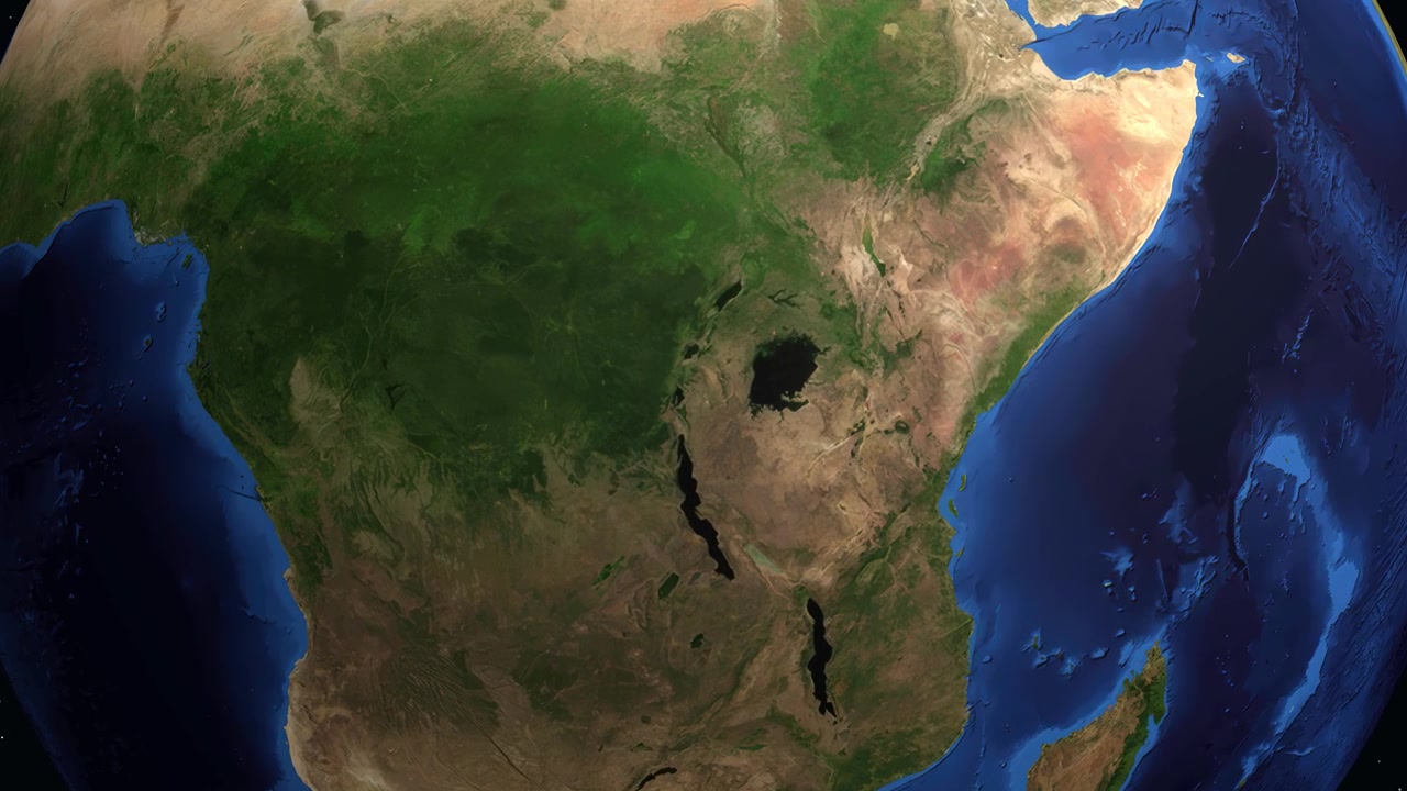 Una animación digital hace zoom desde el espacio exterior hacia un mapa que señala Kigali, Ruanda en la Tierra.