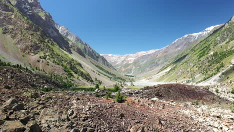 drone shot of the mountains valley and rocky outcrop at naltar valley in pakistan, revealing aerial shot