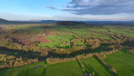 flying over english countryside during golden hour at beacon fell, lancashire, uk