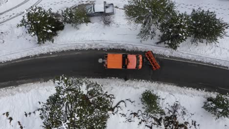 top-down aerial view of a snowplow clearing the roads on troodos mountain