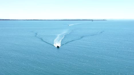 windswept wake is left from motorboating piloting in open ocean