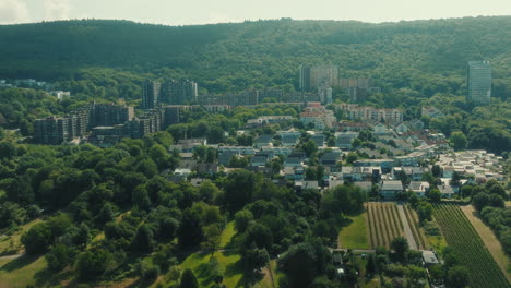 pull out drone shot of emmertsgrund neighborhood and cityscape during the day in heidelberg, state of baden-wurttemberg, germany