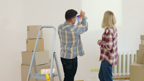 couple discussing paint colors during move