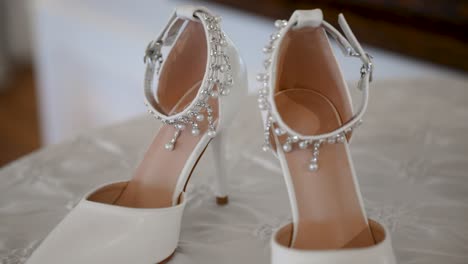 close-up circling view of luxurious bridal shoes on wedding day