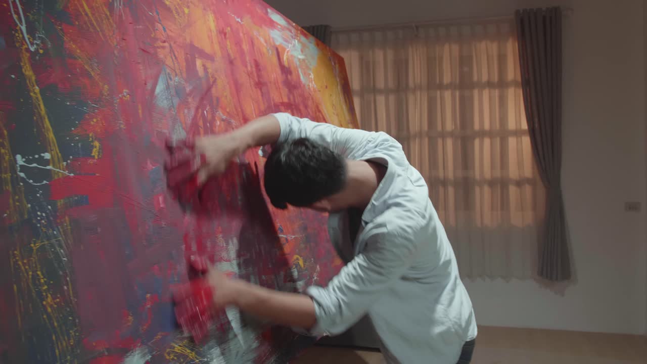 Male Artist Draws With His Hands On The Large Canvas. Contemporary Painter Creating Abstract Modern Art