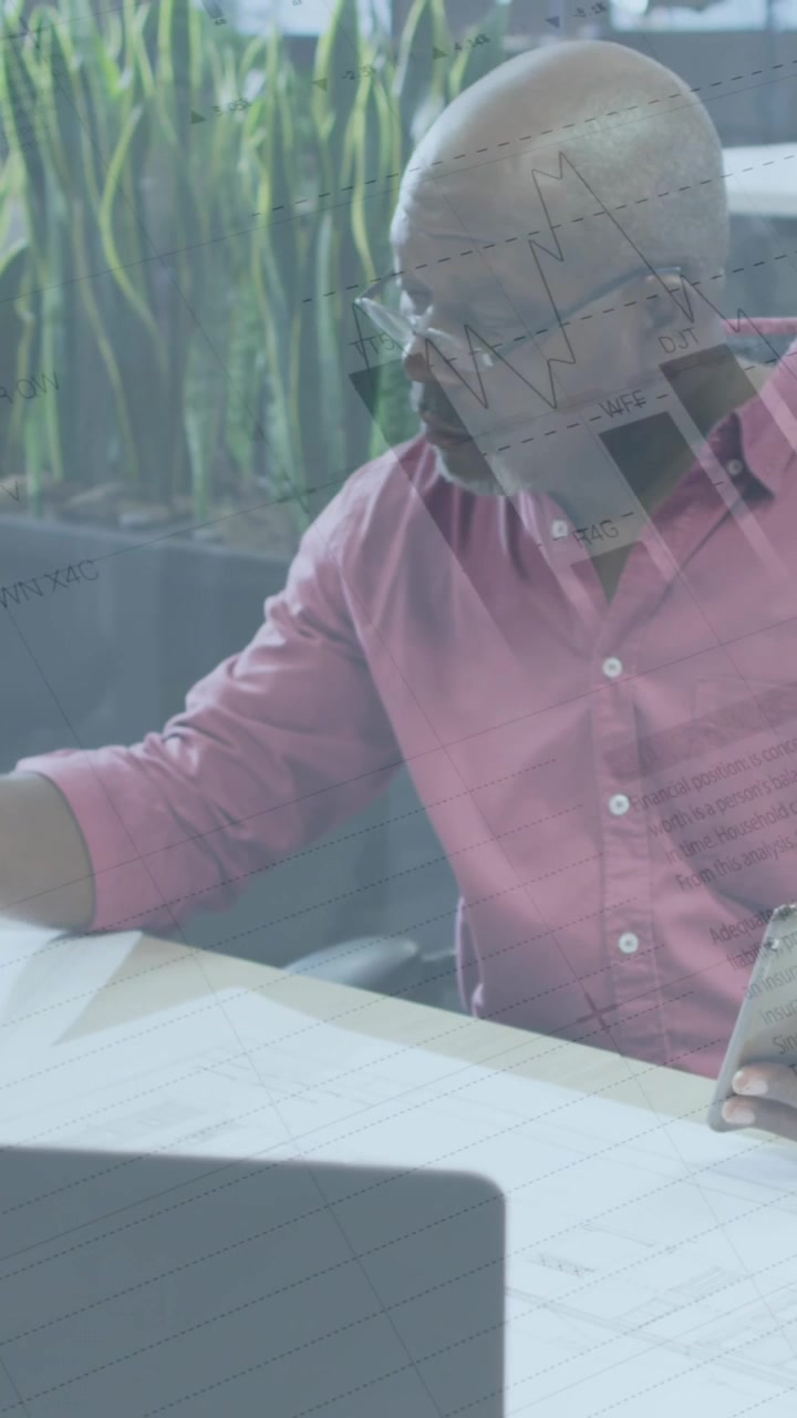 Animation of financial data processing over african american businessman working in office