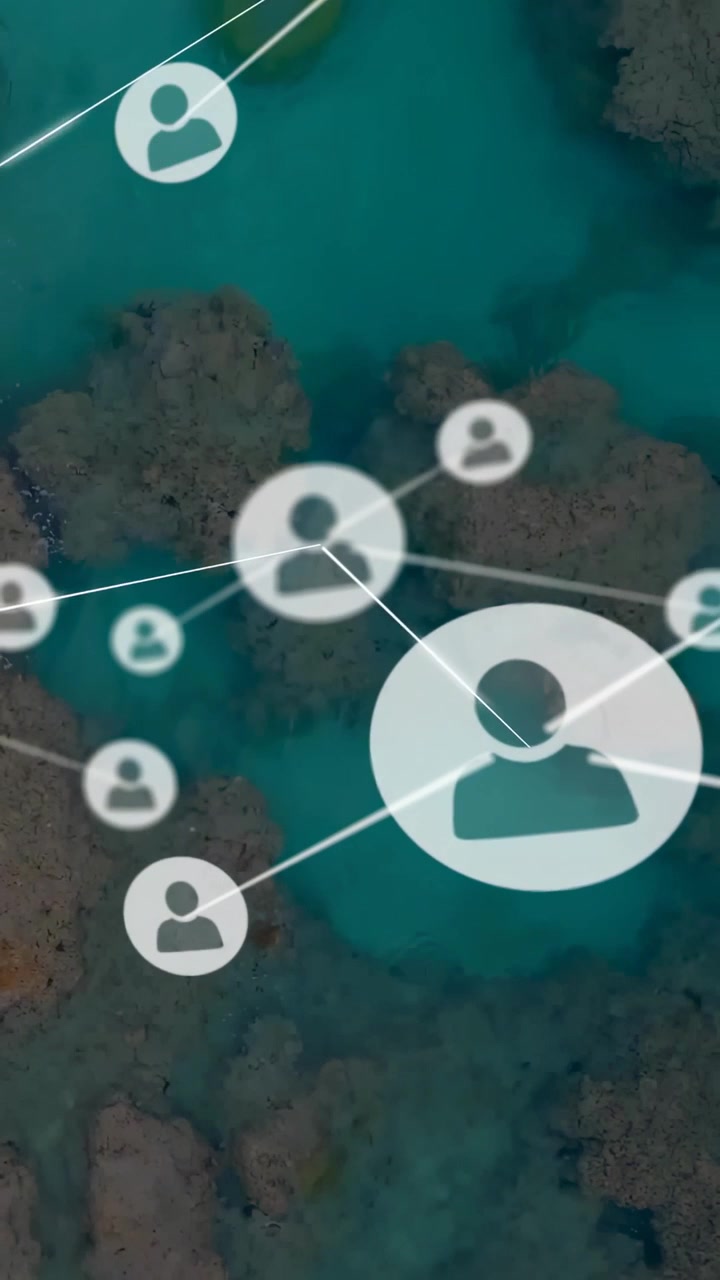 Video verticale: Punti che appaiono, avatar che crescono e linee che si collegano su una barriera corallina turchese, mostrando una rete tecnologica.