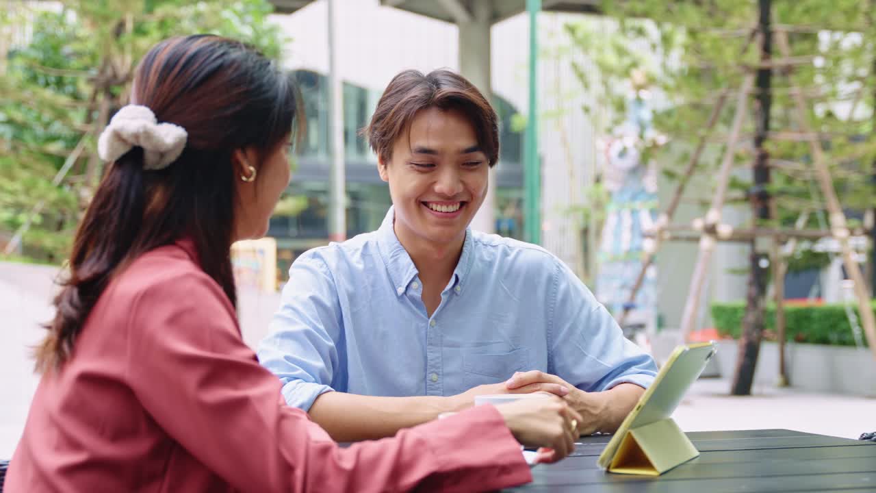 People in a business meeting outdoors