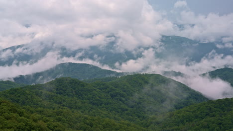 smoky mountains wrapped in layers of cloud and fog — aerial perspective