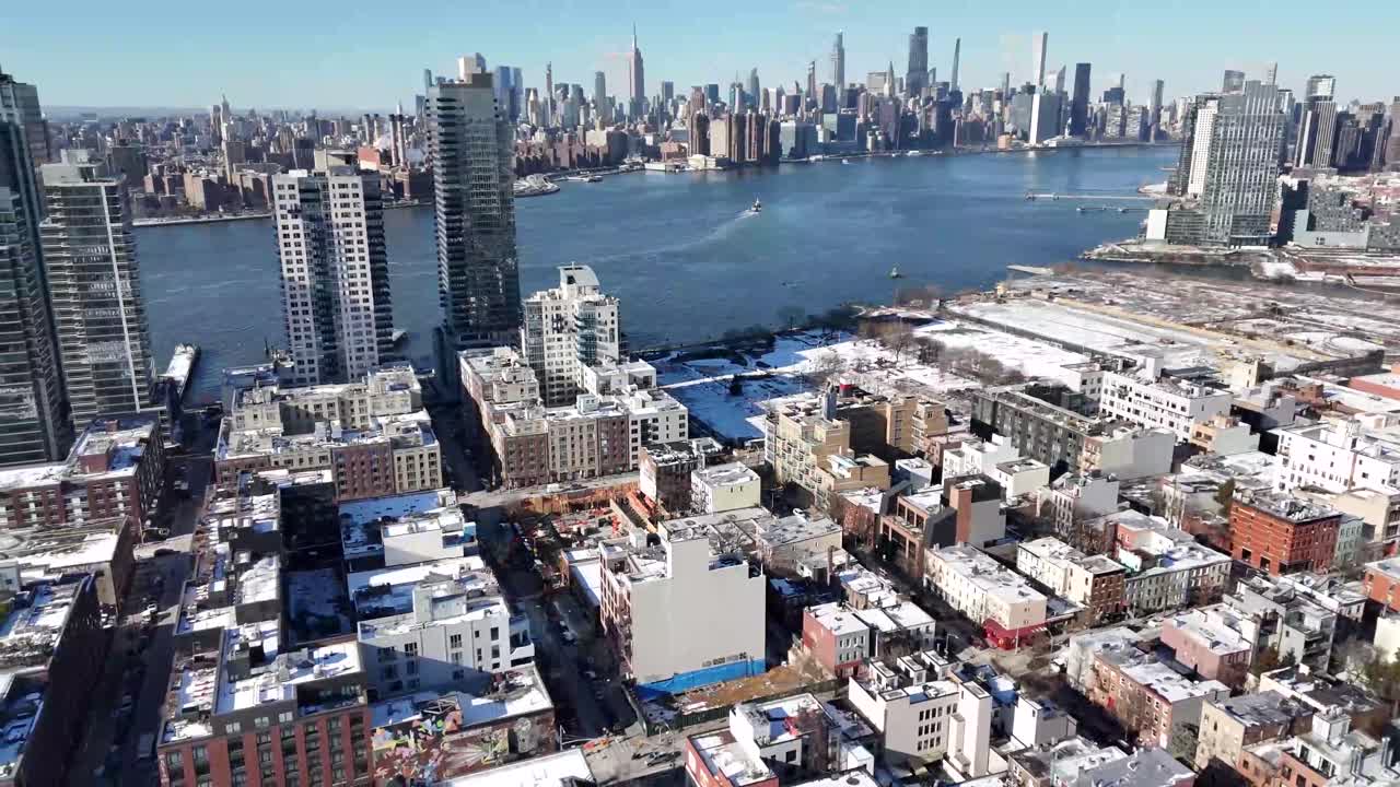 Horizontal drone arc shot over Wythe Ave in Williamsburg, Brooklyn, highlighting New York’s dynamic skyline, historic buildings, and vibrant streets with a smooth and sweeping aerial curve.