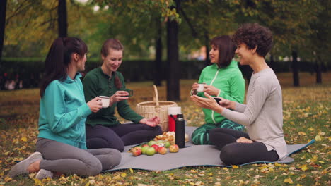 women enjoying a picnic in the park