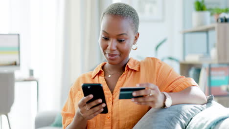 black woman, credit card and phone for online