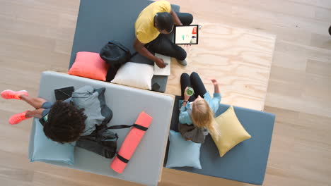 people relaxing and working in a modern office space