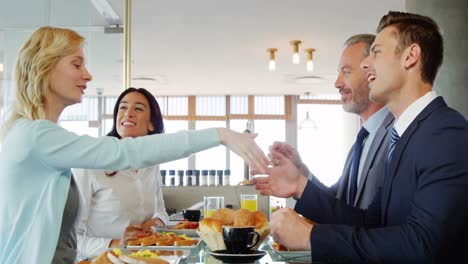 a woman meeting two men