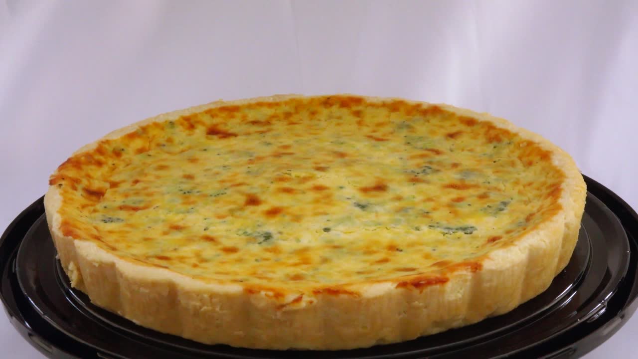 A savory broccoli quiche delight featuring fresh broccoli florets baked into a creamy egg filling creating a wholesome flavorful dish perfect for breakfast brunch or anytime enjoyment