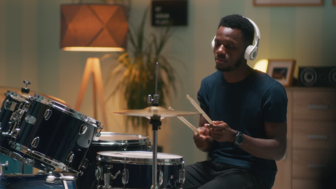 African American Drummer Discussing Rhythmic Pattern at Rehearsal Shot of African American Conga Drummer Discussing Rhythmic Pattern with other Musician while Rehearsing New Composition