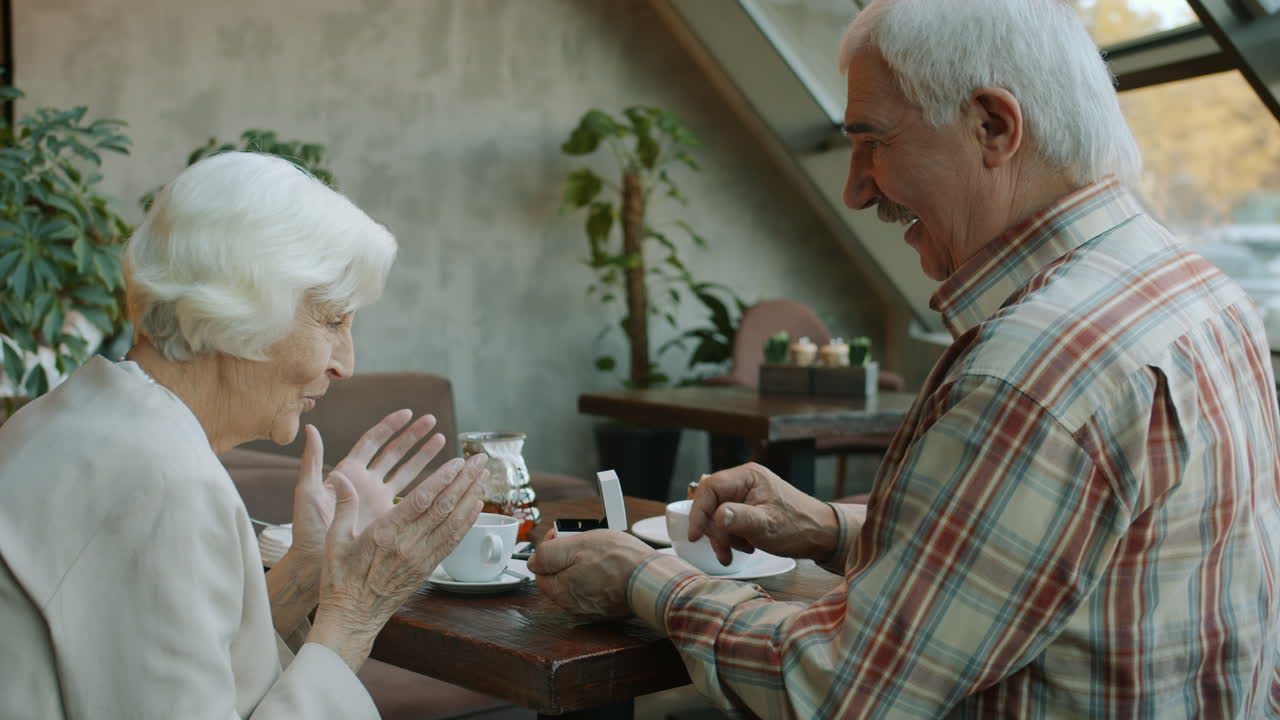 Elderly Couple's Engagement Proposal in a Cafe