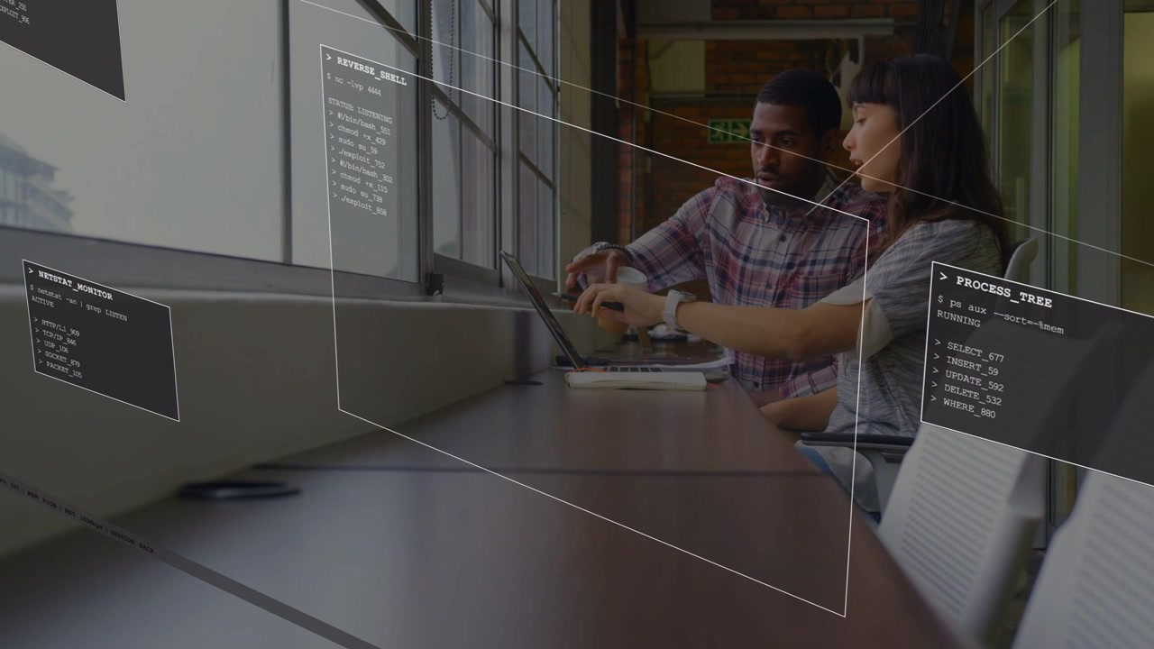 Female dev pointing laptop initiating AR code panels overlaying, male dev mirroring debugging