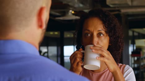 female executive having coffee in cafeteria 4k