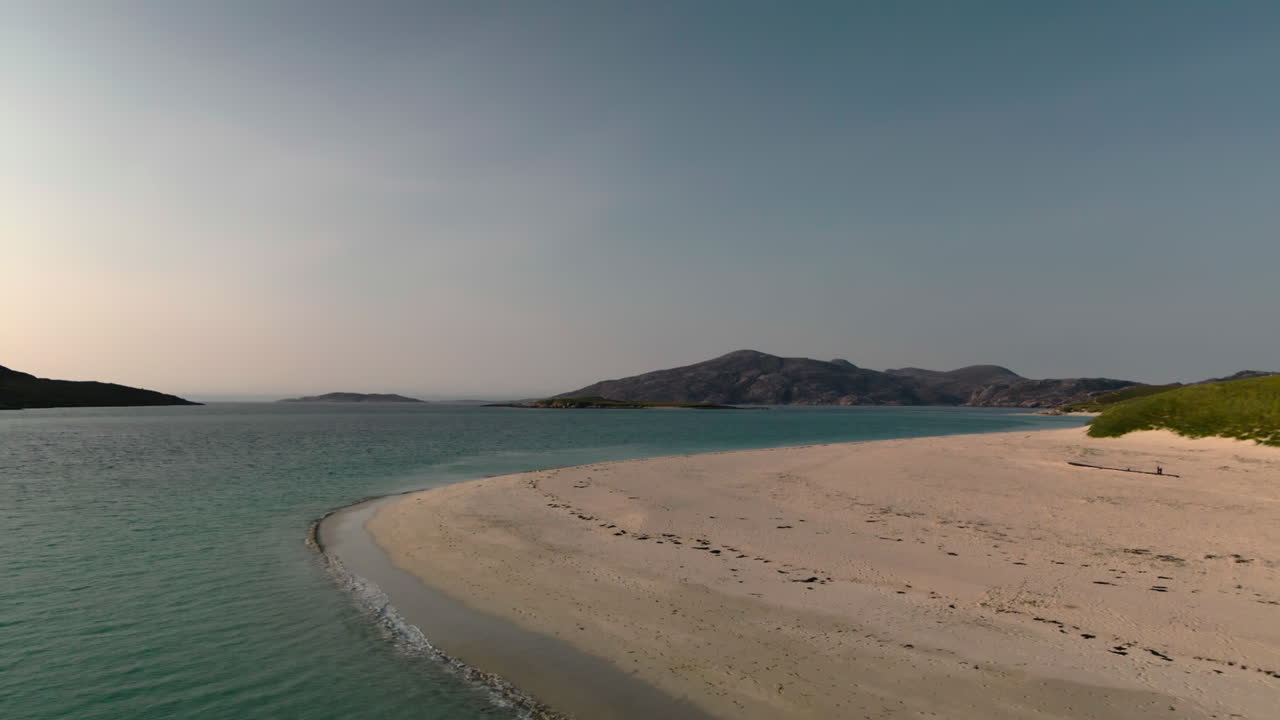 Reverse ascending shot of empty beach on summers day in Outer Hebrides