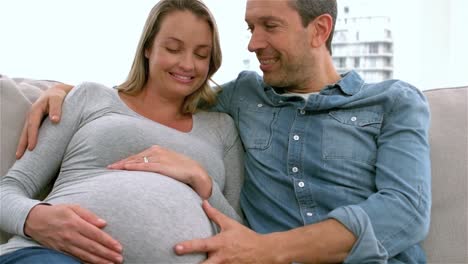 Happy-future-parents-on-sofa