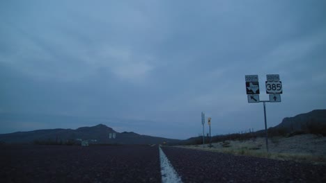 texas highway 385 sign near big bend at blue hour 4k right to left dolly