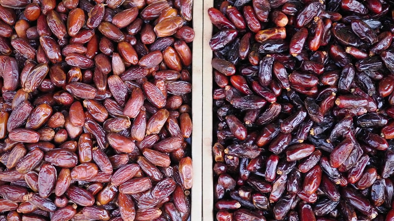 Top View of Fresh Dates in Wooden Crates at Market