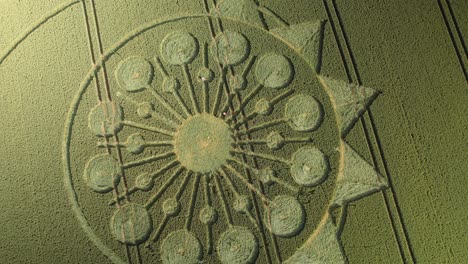 fields with crop circle formation in owslebury, england - aerial drone shot