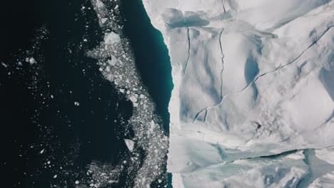 drone over sea and ice of ilulissat icefjord