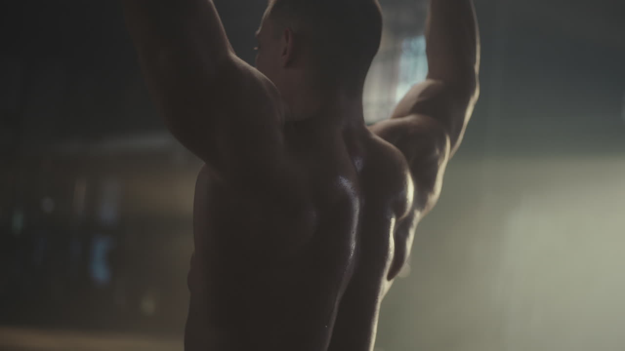 Muscular Man Performing Back Exercises