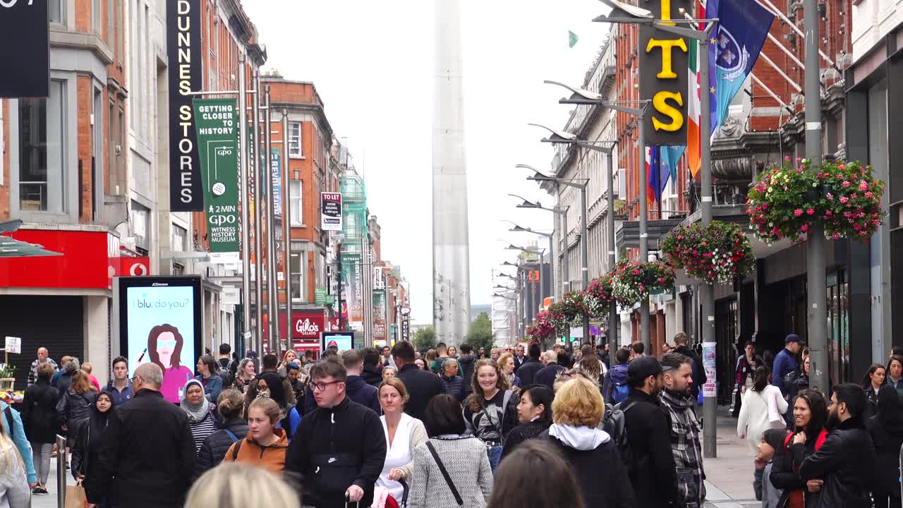 Busy shopping street in central Dublin, the spire in the background.  September 2019 Editorial use only