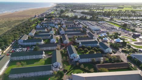 Aerial-drone-footage-of-the-famous-Butllins-holiday-camp-based-in-the-seaside-town-of-Skegness-Lancashire,-UK