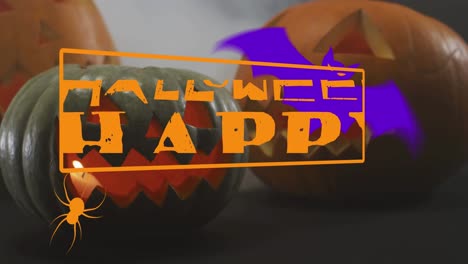 Animation-of-happy-halloween-text-with-bat-and-spider-over-carved-pumpkins
