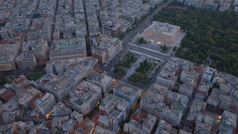 circling aerial shot over syntagma square central athens at night