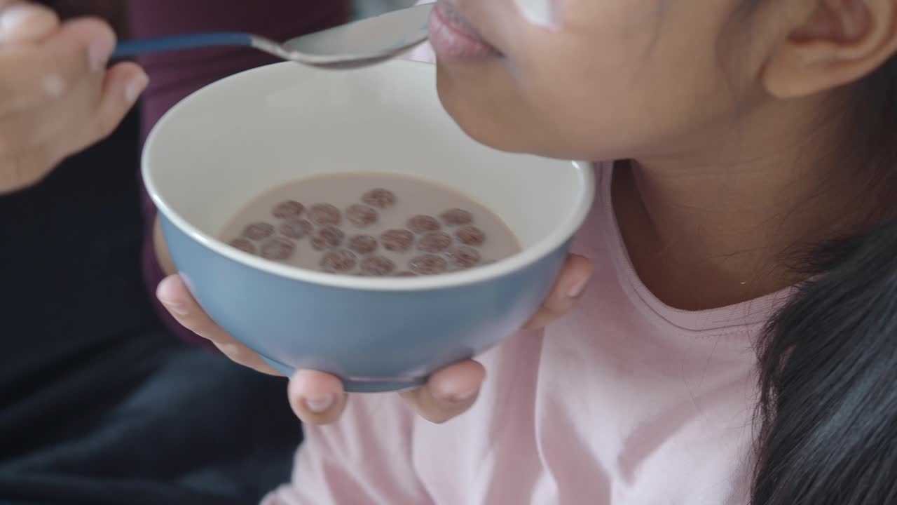 Eating cereal from a bowl