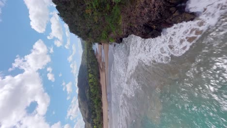 Flying-over-coastal-jungle-following-the-Río-San-Juan-river,-in-Samana,-Dominican-Republic---Vertical-FPV-drone-shot