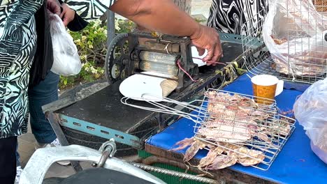 street food vendor selling fried squid