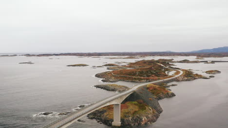 aerial view of storseisundet bridge surrounded by sea and islets, atlantic road, more og romsdal county, norway, scandinavia, europe - drone shot