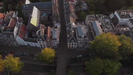 Aerial-early-morning-descend-showing-canal-houses-in-the-medieval-Dutch-city-of-Utrecht-at-sunrise