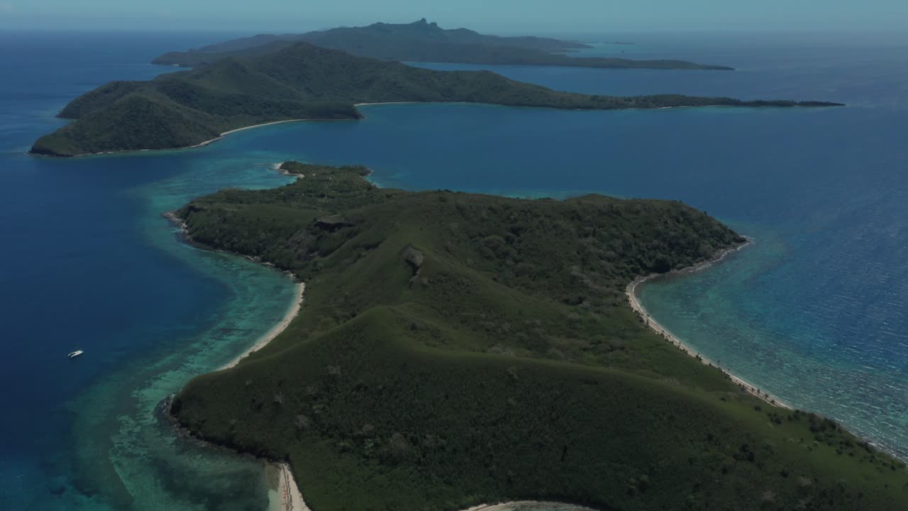 Turtle Island, Fiji - The Lush Tropical Paradise Of Green Trees And White Sand Surrounded By The Big Blue Ocean - Aerial Shot