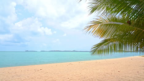 A-deserted-beach-looks-out-over-a-quiet-ocean-bay