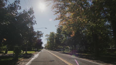 wilson, ny, usa, october 2021: drive forward on a road through a typical american city.