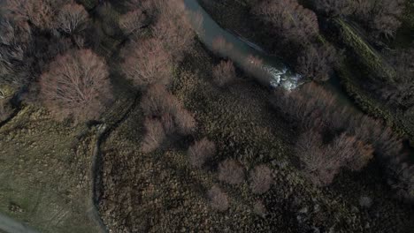 River-Flows-Through-Rugged,-Winter-New-Zealand-Landscape