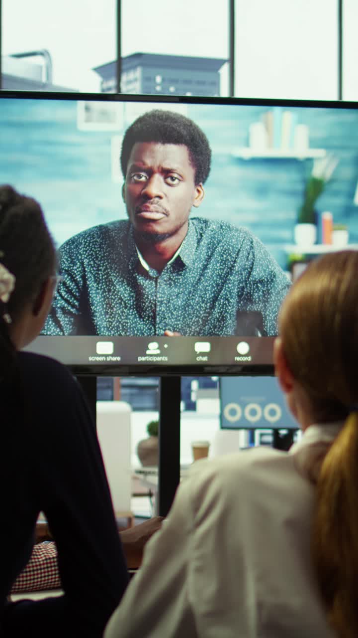 Vertical Video CEO leading a meeting on online teleconference call in the boardroom