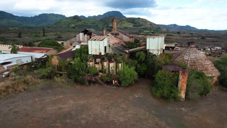 zooming out of abandoned koloa sugar mill aerial footage, drone