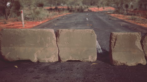 old-rusted-concrete-road-barrier-blocks