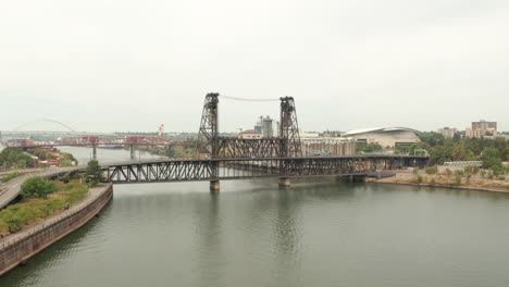 Circling-aerial-shot-of-Steel-Bridge-Portland-Oregon