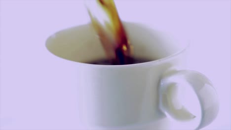 coffee is poured into a cup